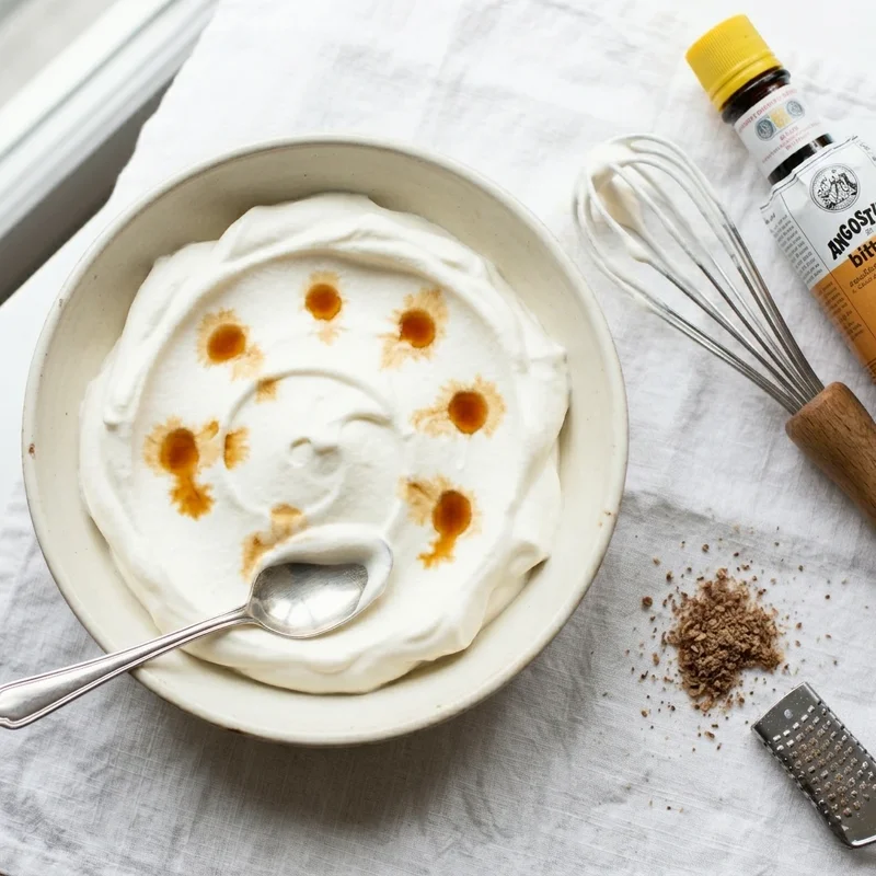 Lightly sweetened whipped cream perfumed with aromatic bitters — a Trinidadian topping for hot chocolate, pies, and coffee